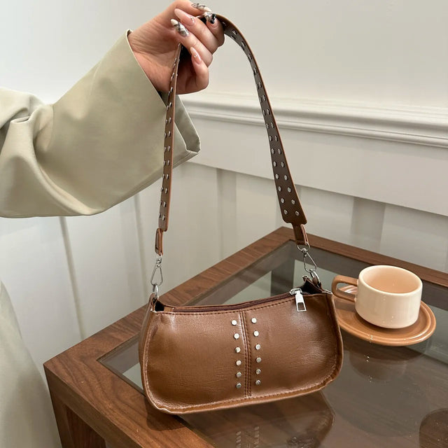 Small PU leather studded shoulder bag.