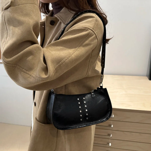 Small PU leather studded shoulder bag.