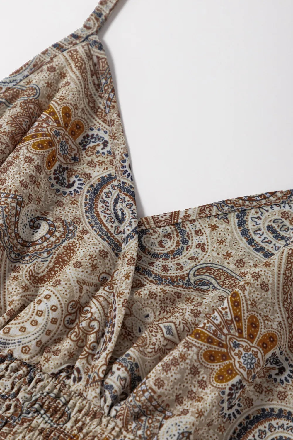 Paisley printed smocked babydoll cami.