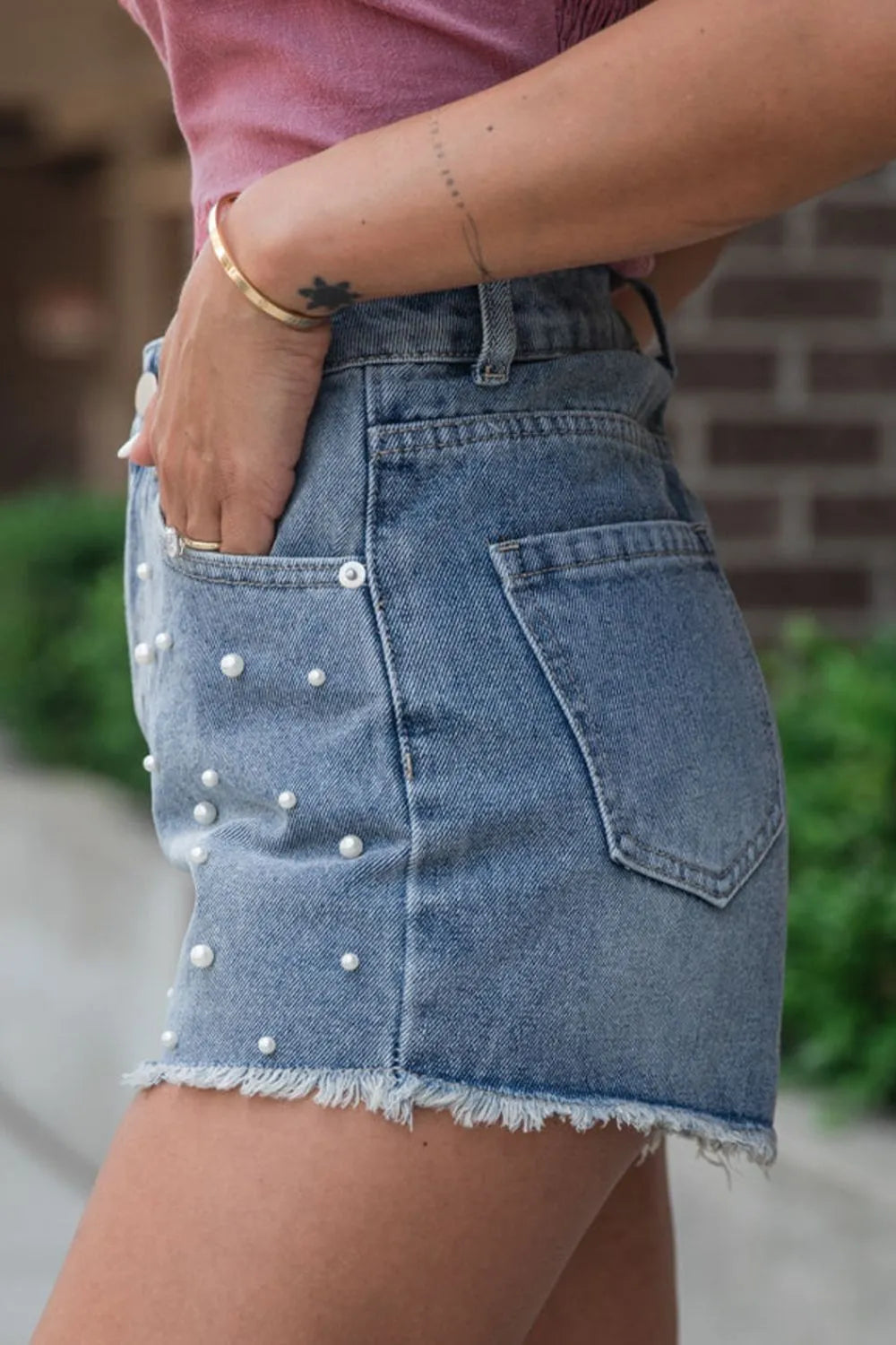 High-waist washed denim shorts with pockets.