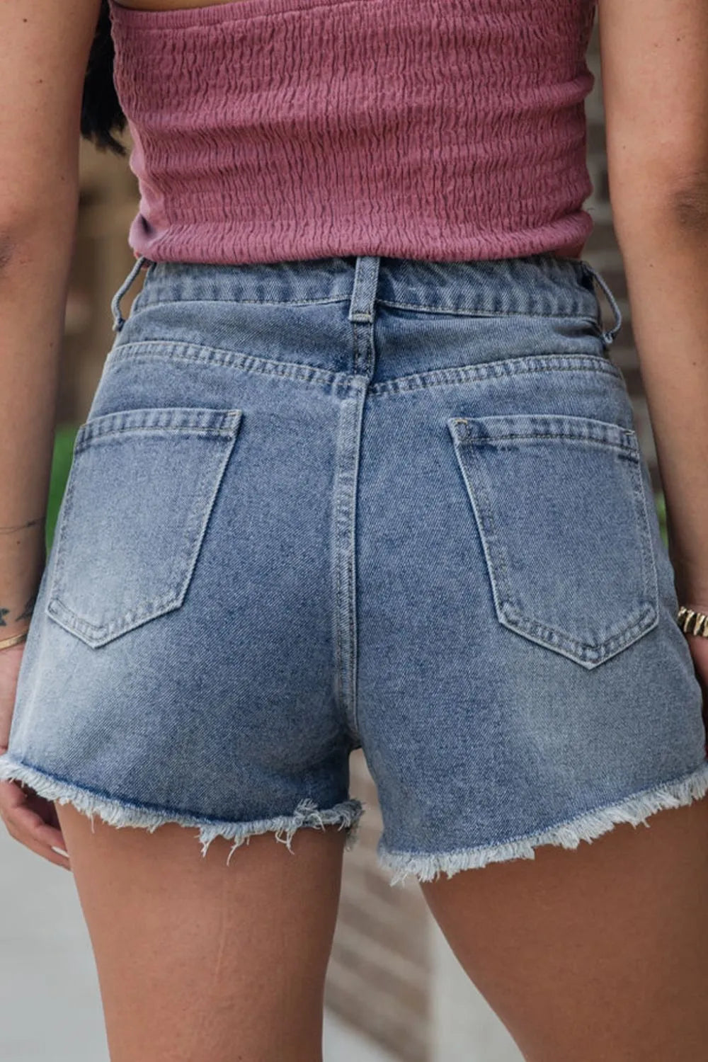 High-waist washed denim shorts with pockets.