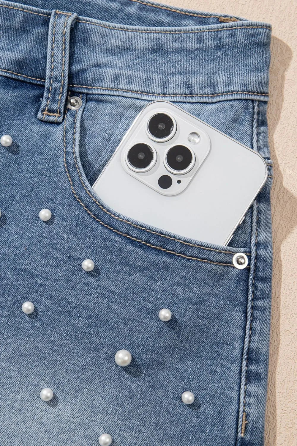 High-waist washed denim shorts with pockets.