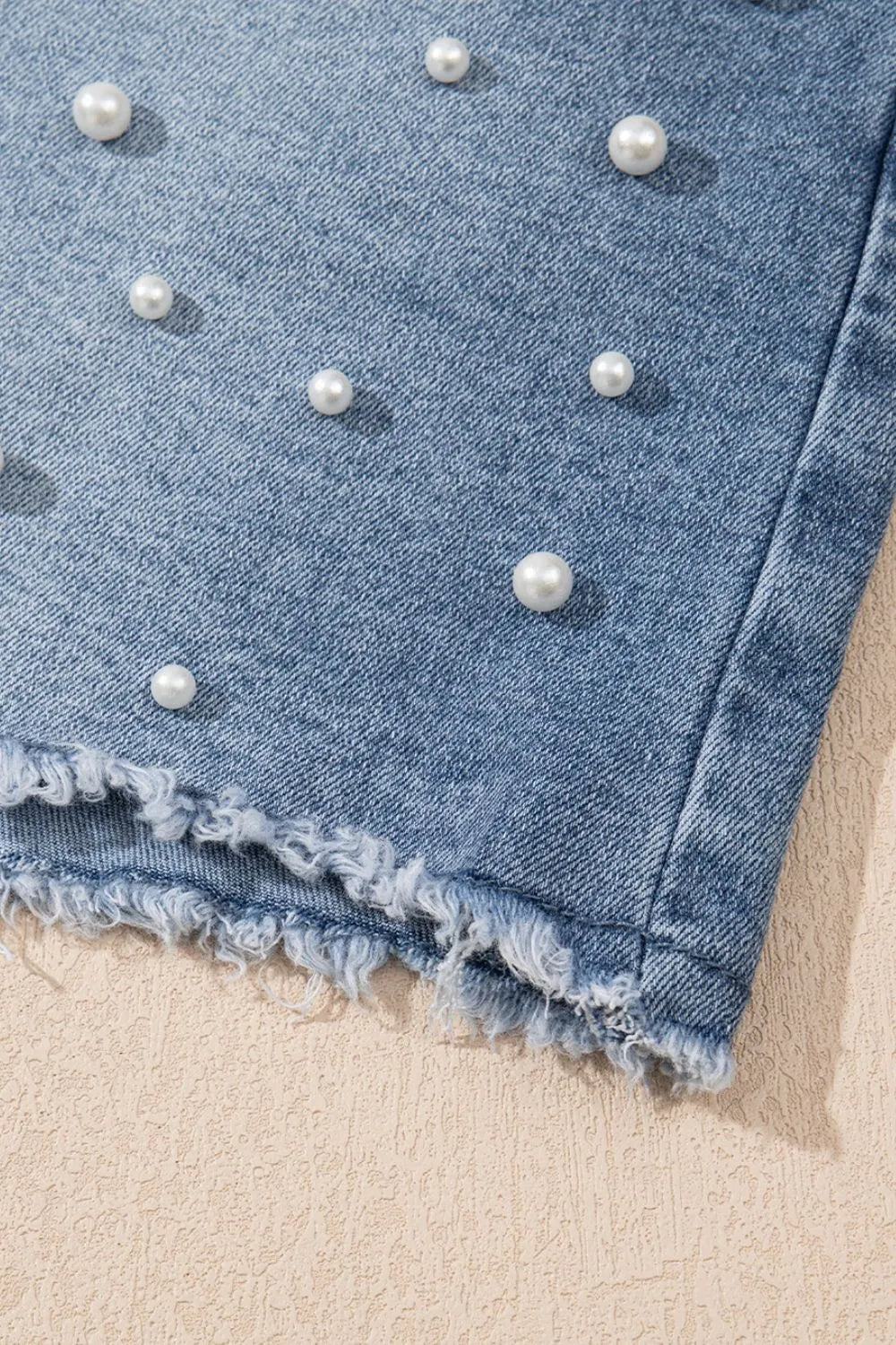 High-waist washed denim shorts with pockets.
