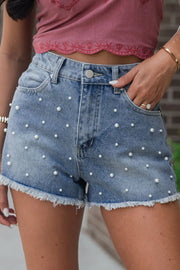 High-waist washed denim shorts with pockets.