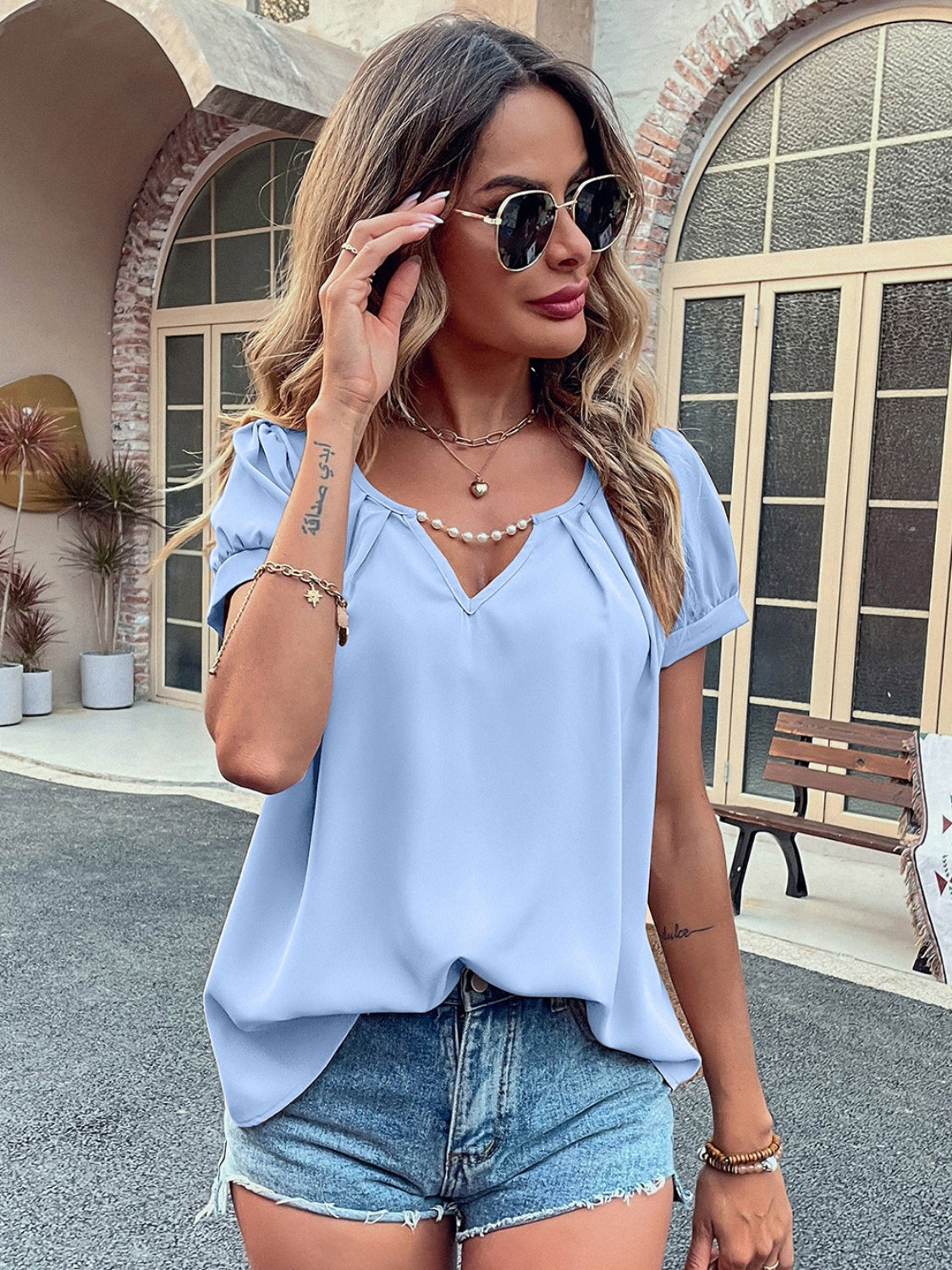 Ivy Lane Pearl Detail Notched Short Sleeve Blouse with Ruched and Cutout.