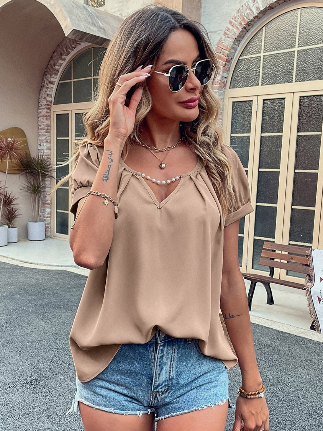 Ivy Lane Pearl Detail Notched Short Sleeve Blouse with Ruched and Cutout.