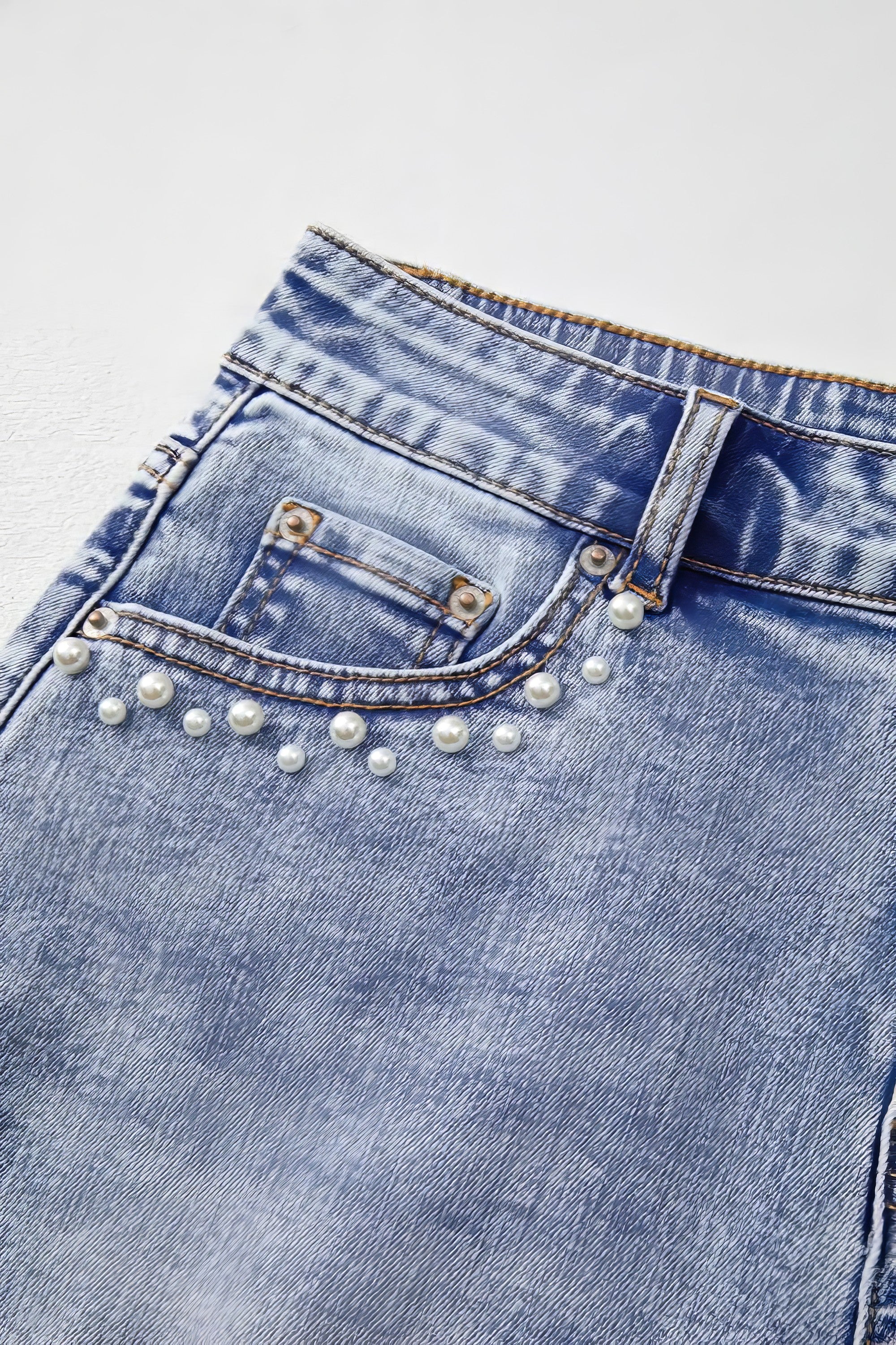 Pearl studded pockets raw hem denim shorts.