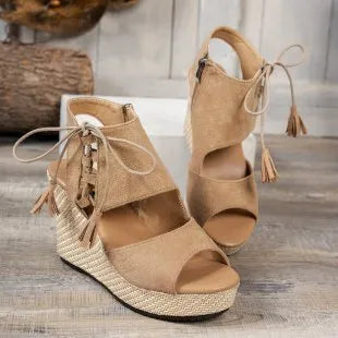 Suede peep toe mid-heel wedge sandals.