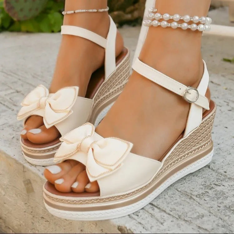Open toe mid-heel wedge sandals.