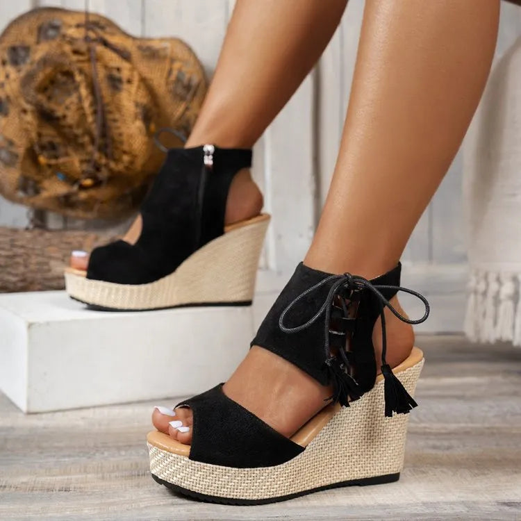 Suede peep toe mid-heel wedge sandals.