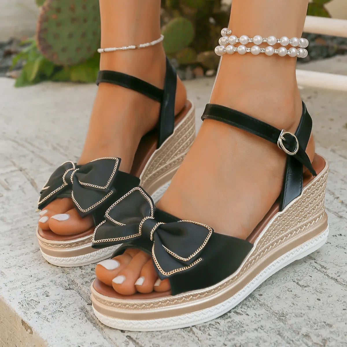 Open toe mid-heel wedge sandals.