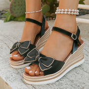 Open toe mid-heel wedge sandals.