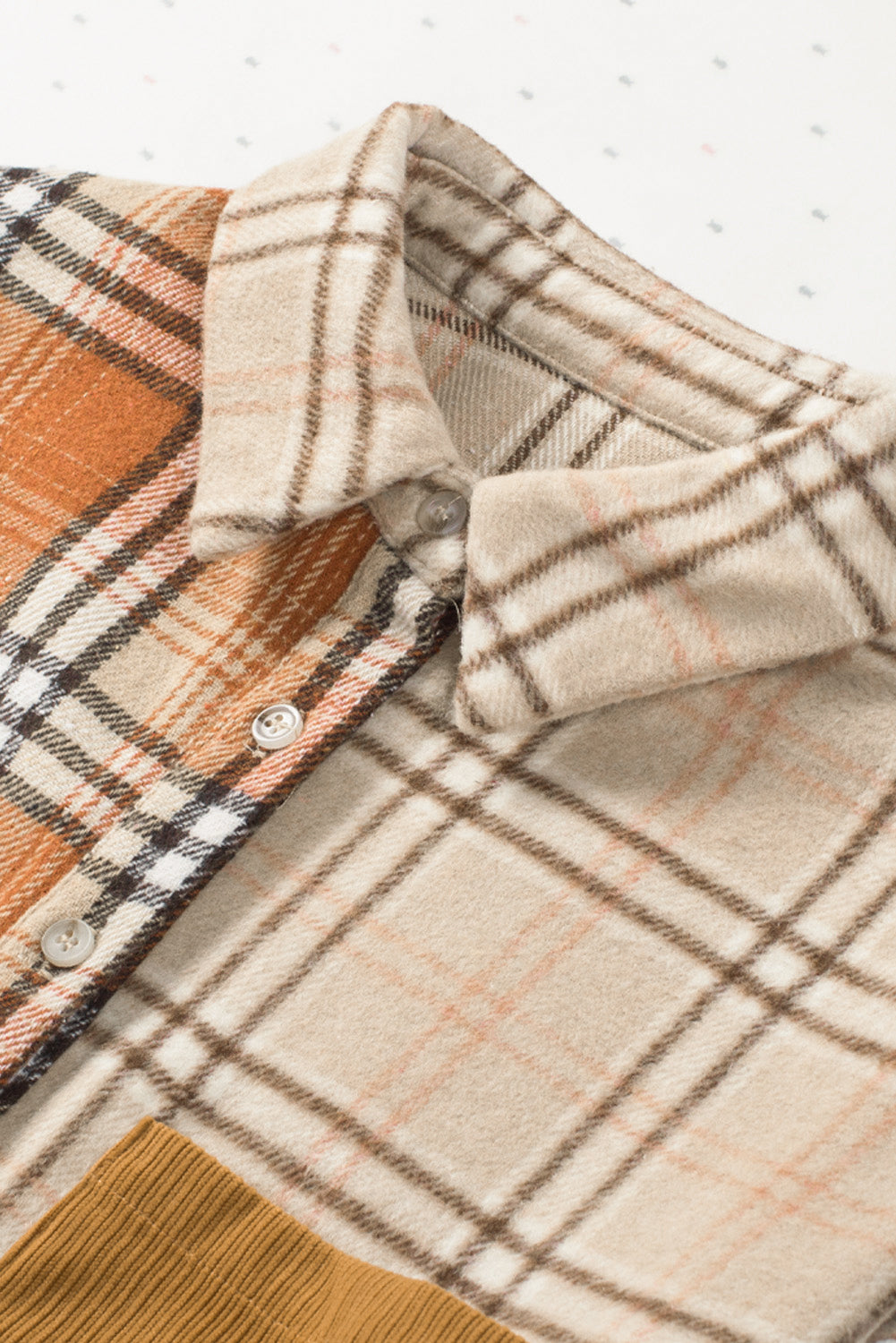 Plaid button up long sleeve shacket with pockets.