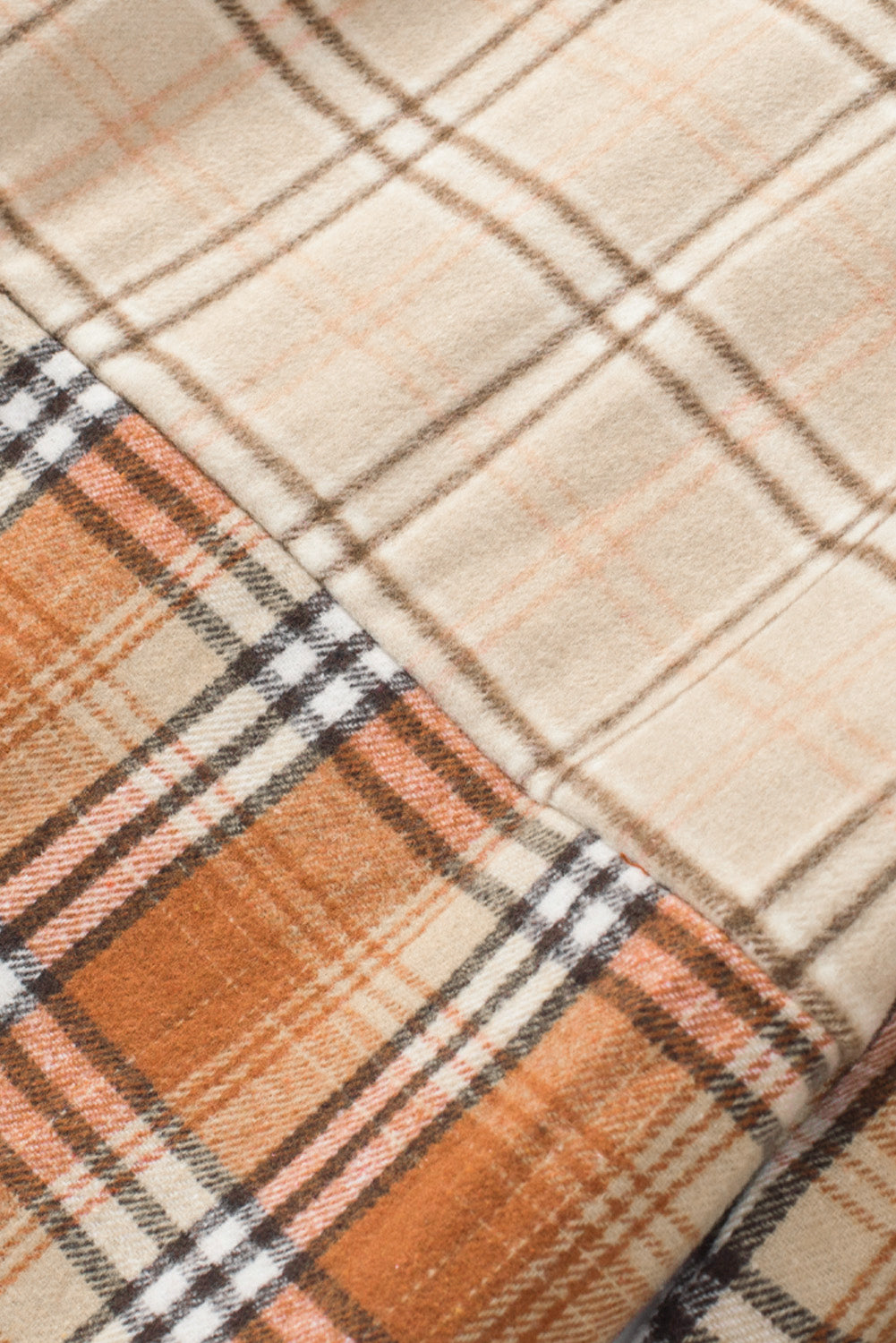 Plaid button up long sleeve shacket with pockets.
