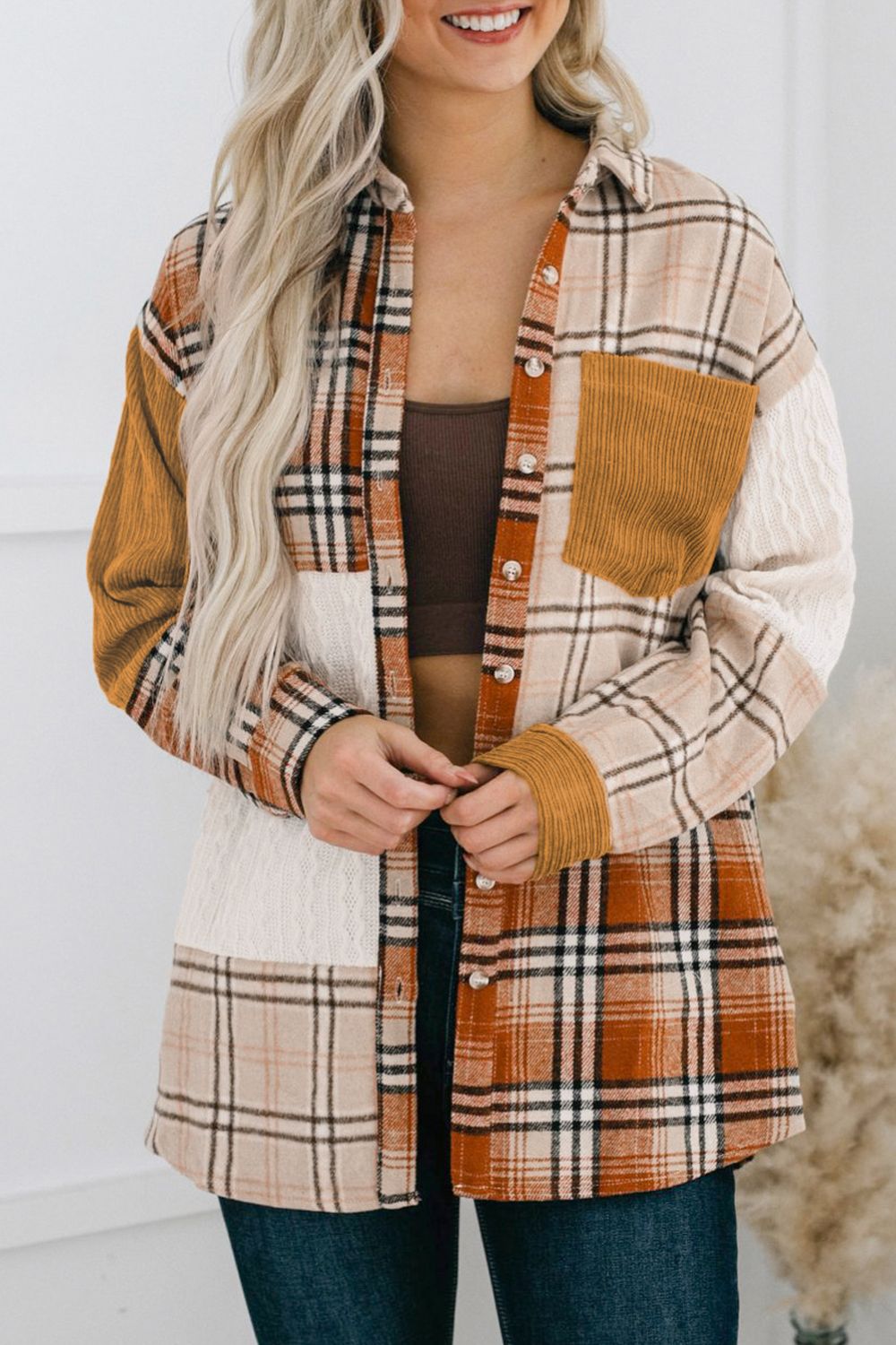 Plaid button up long sleeve shacket with pockets.