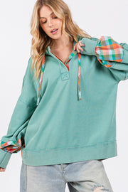 Full size plaid print washed hoodie with exposed seams, drawstring, and half buttons.