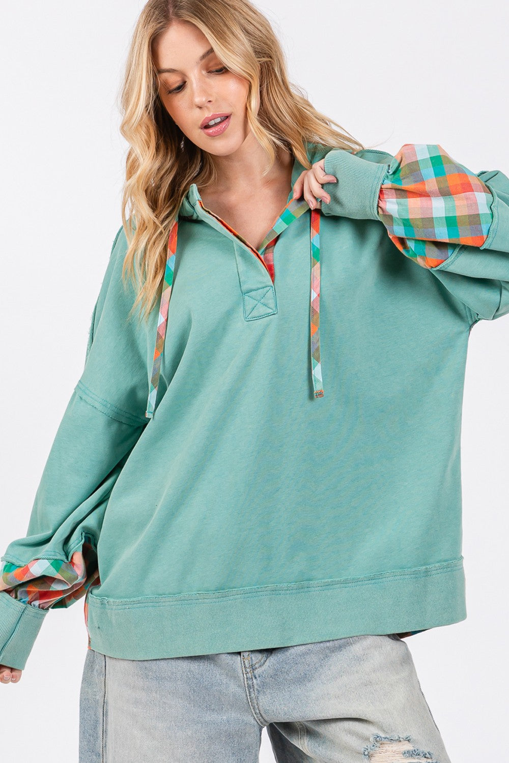 Full size plaid print washed hoodie with exposed seams, drawstring, and half buttons.