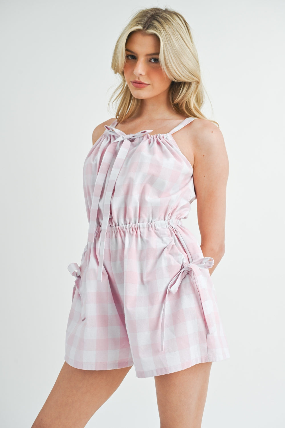Plaid Sleeveless Button Down Romper with Ruched, Tied, Drawstring, and Pockets.