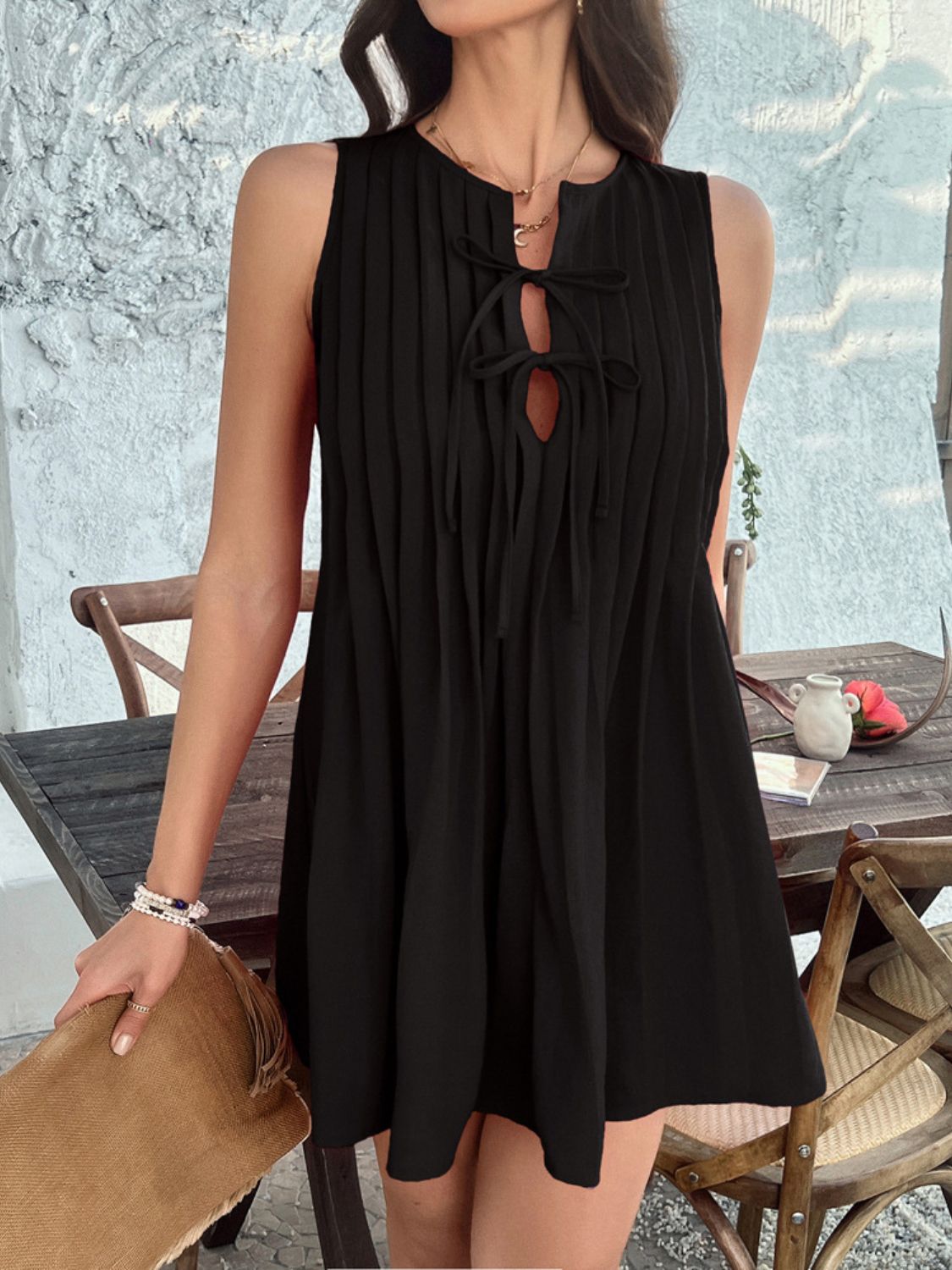 Devine Pleated Sleeveless Mini Dress.