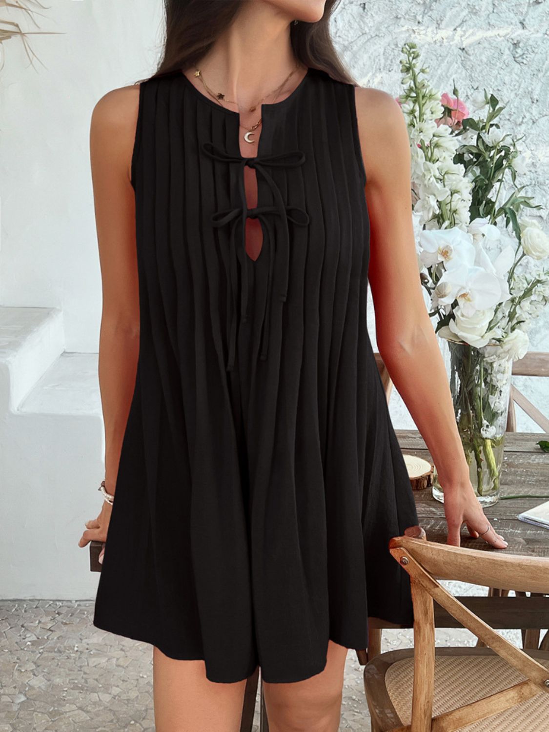 Devine Pleated Sleeveless Mini Dress.