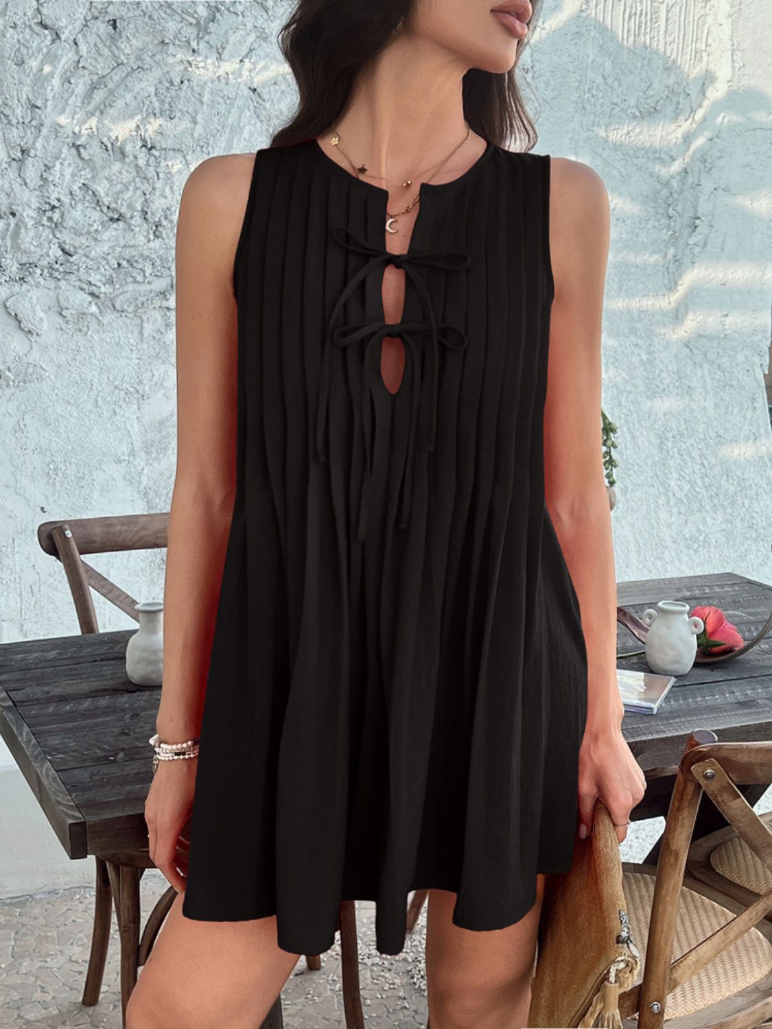 Devine Pleated Sleeveless Mini Dress.