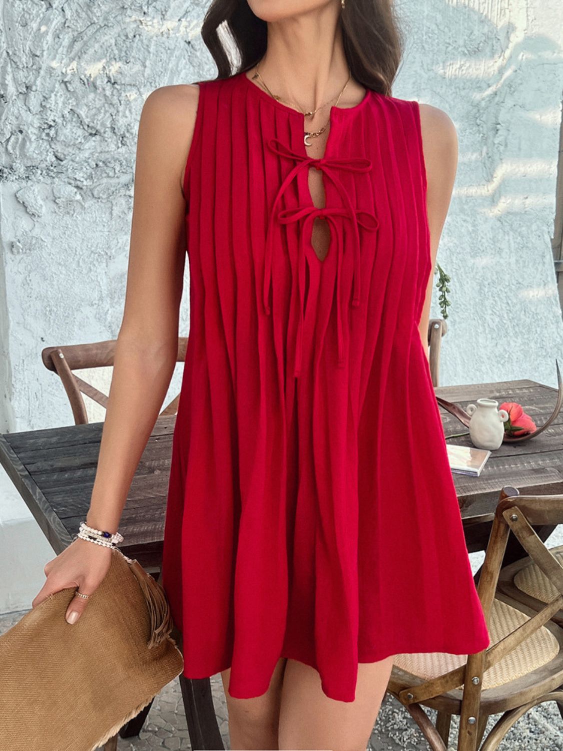 Devine Pleated Sleeveless Mini Dress.