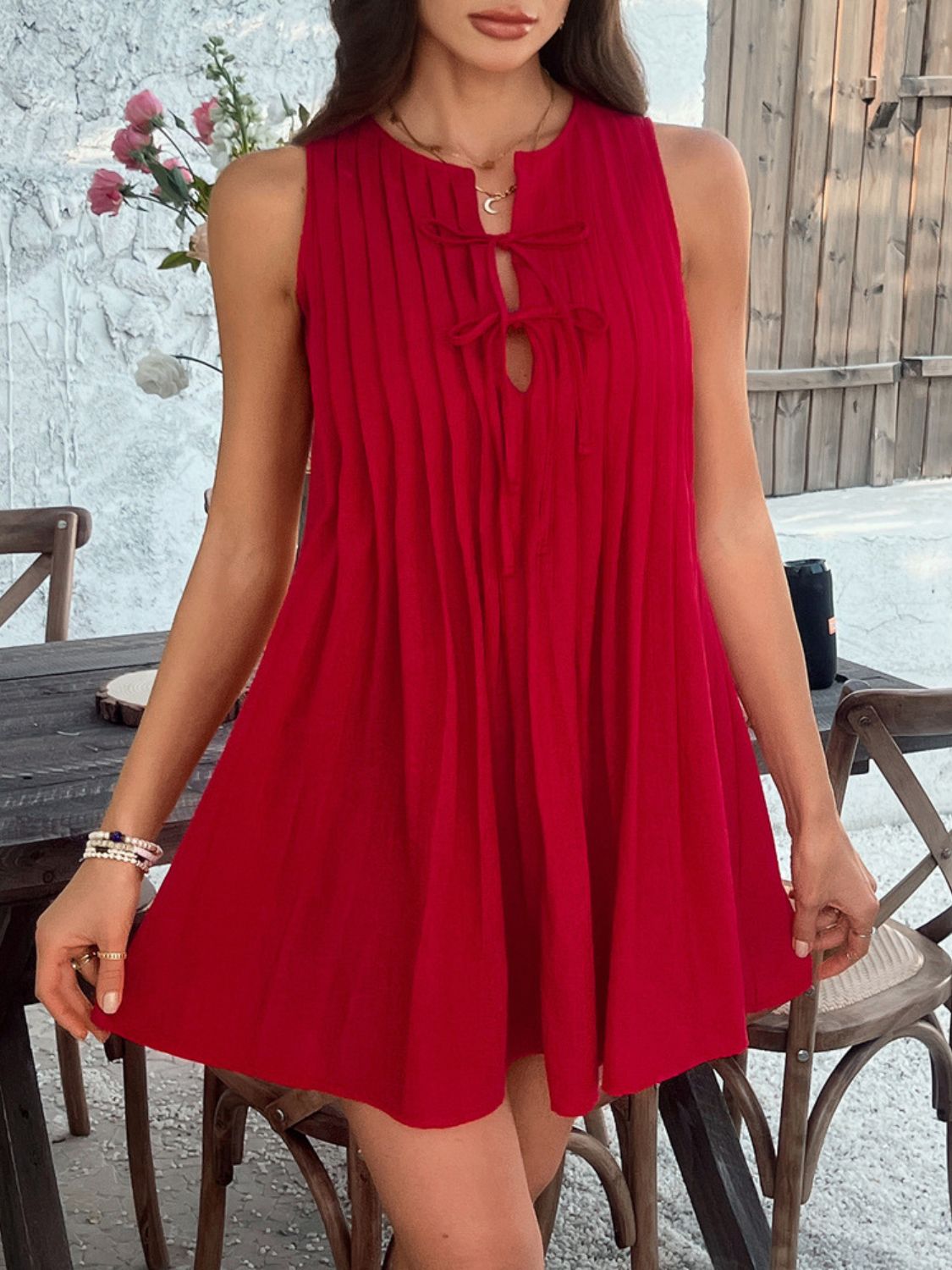 Devine Pleated Sleeveless Mini Dress.