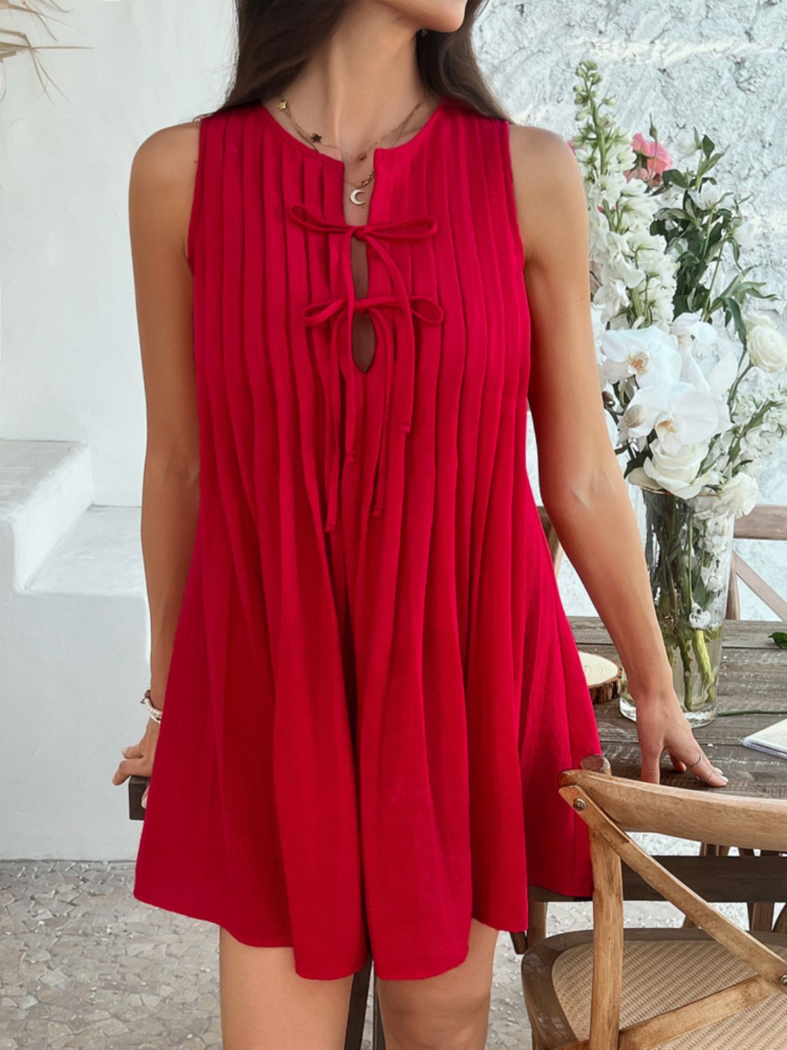 Devine Pleated Sleeveless Mini Dress.