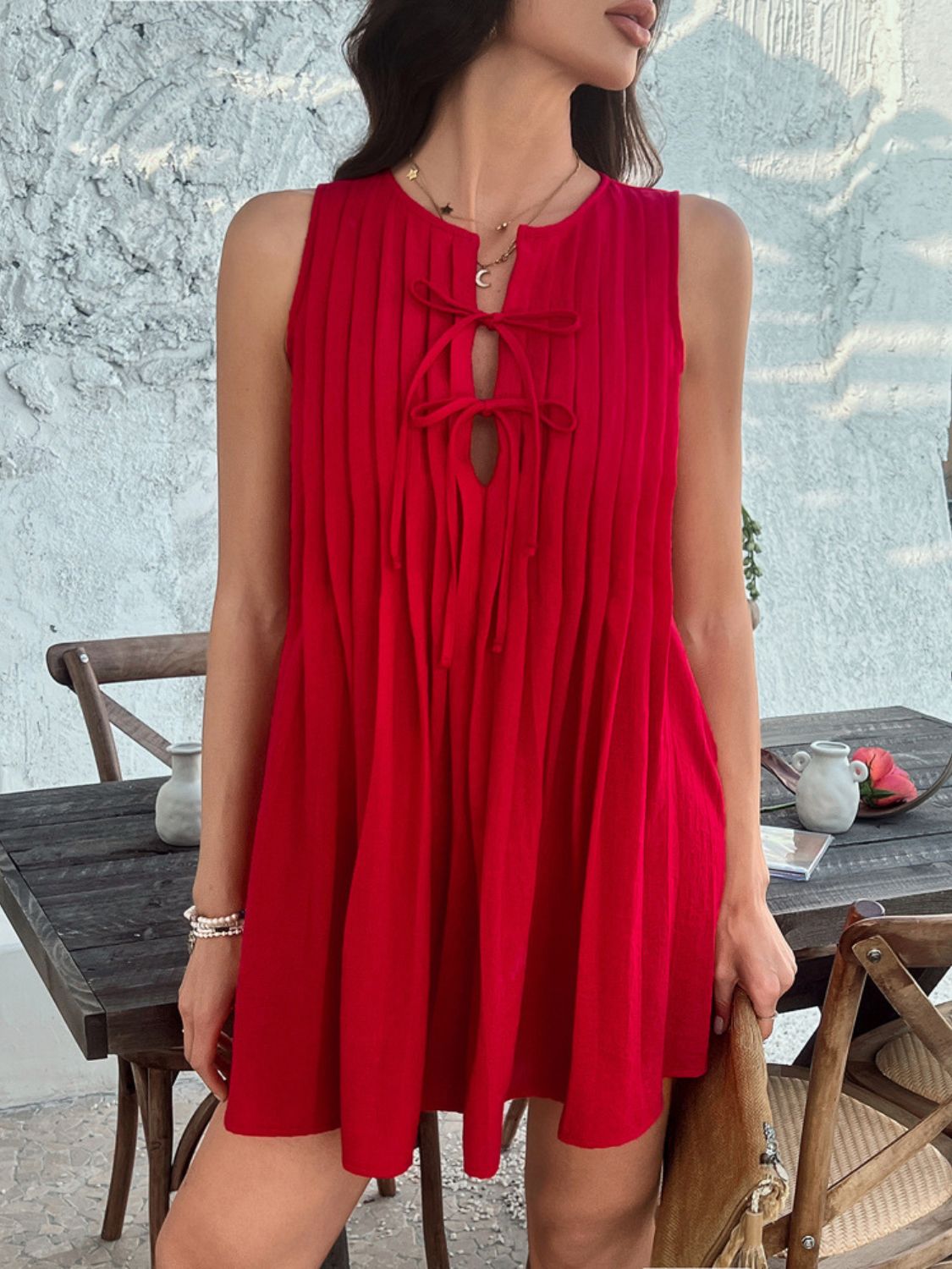 Devine Pleated Sleeveless Mini Dress.
