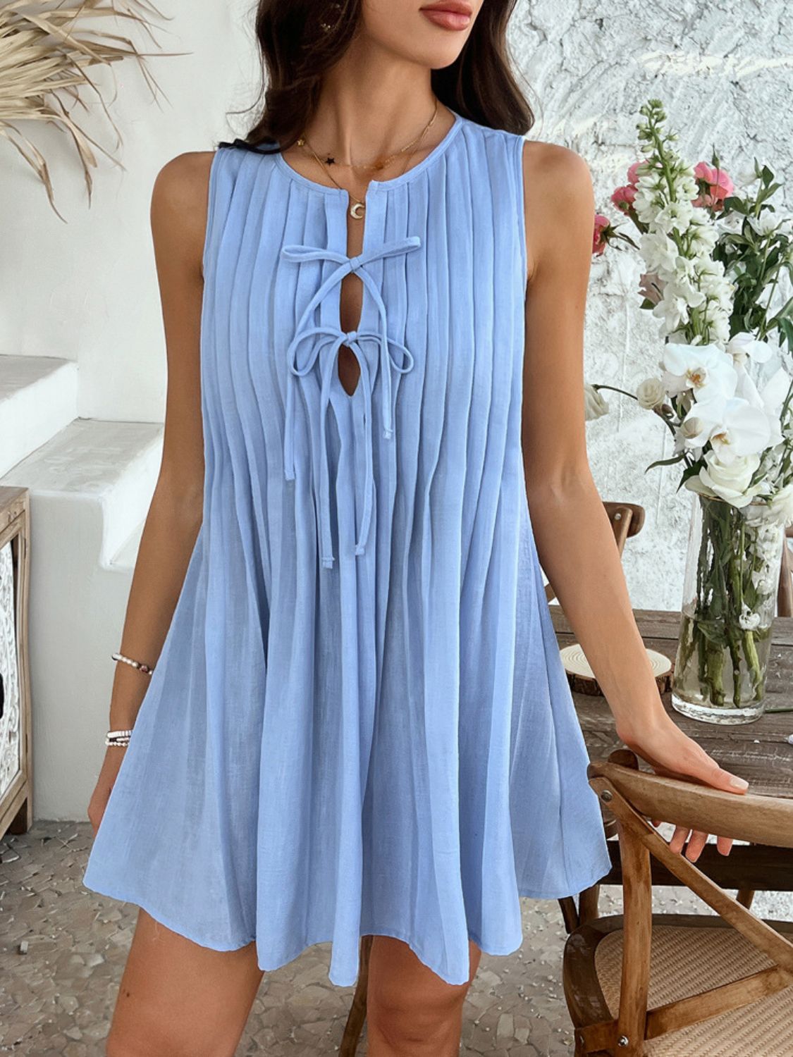 Devine Pleated Sleeveless Mini Dress.