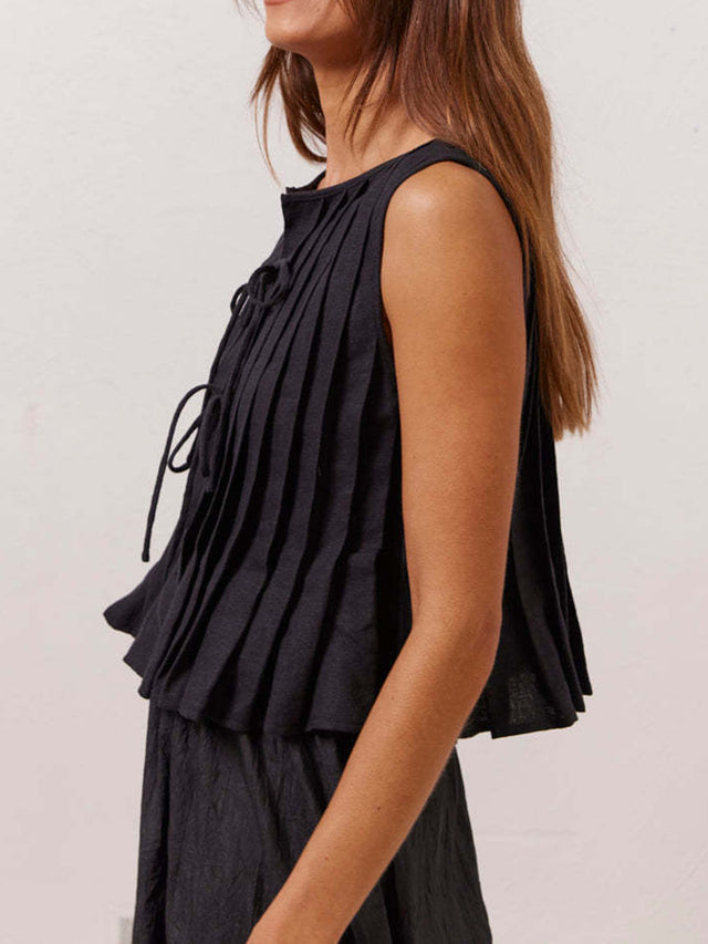 Pleated tied round neck vest.