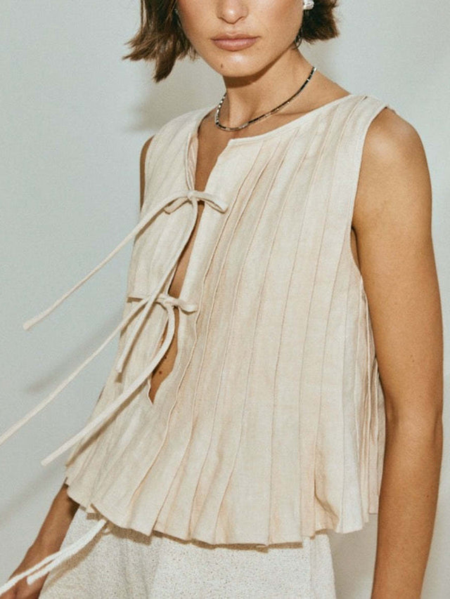 Pleated tied round neck vest.