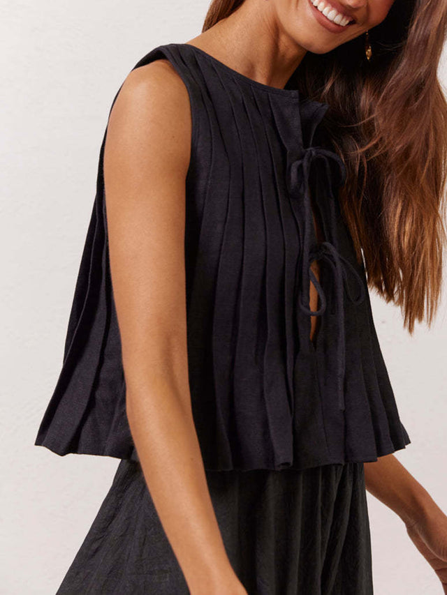 Pleated tied round neck vest.
