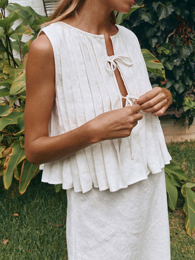 Pleated tied round neck vest.