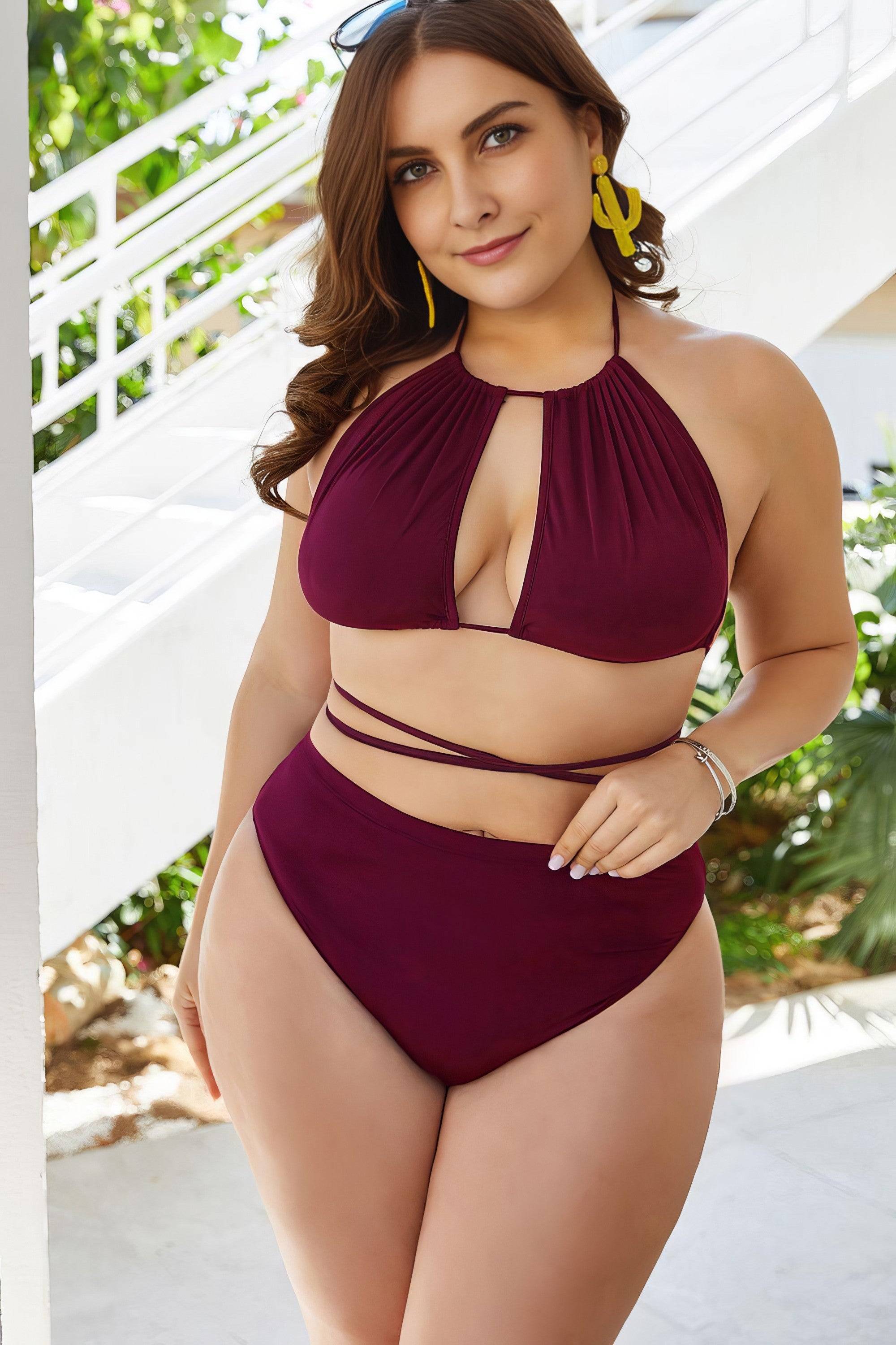 Plus size solid cutout tied backless halter neck bikini set.