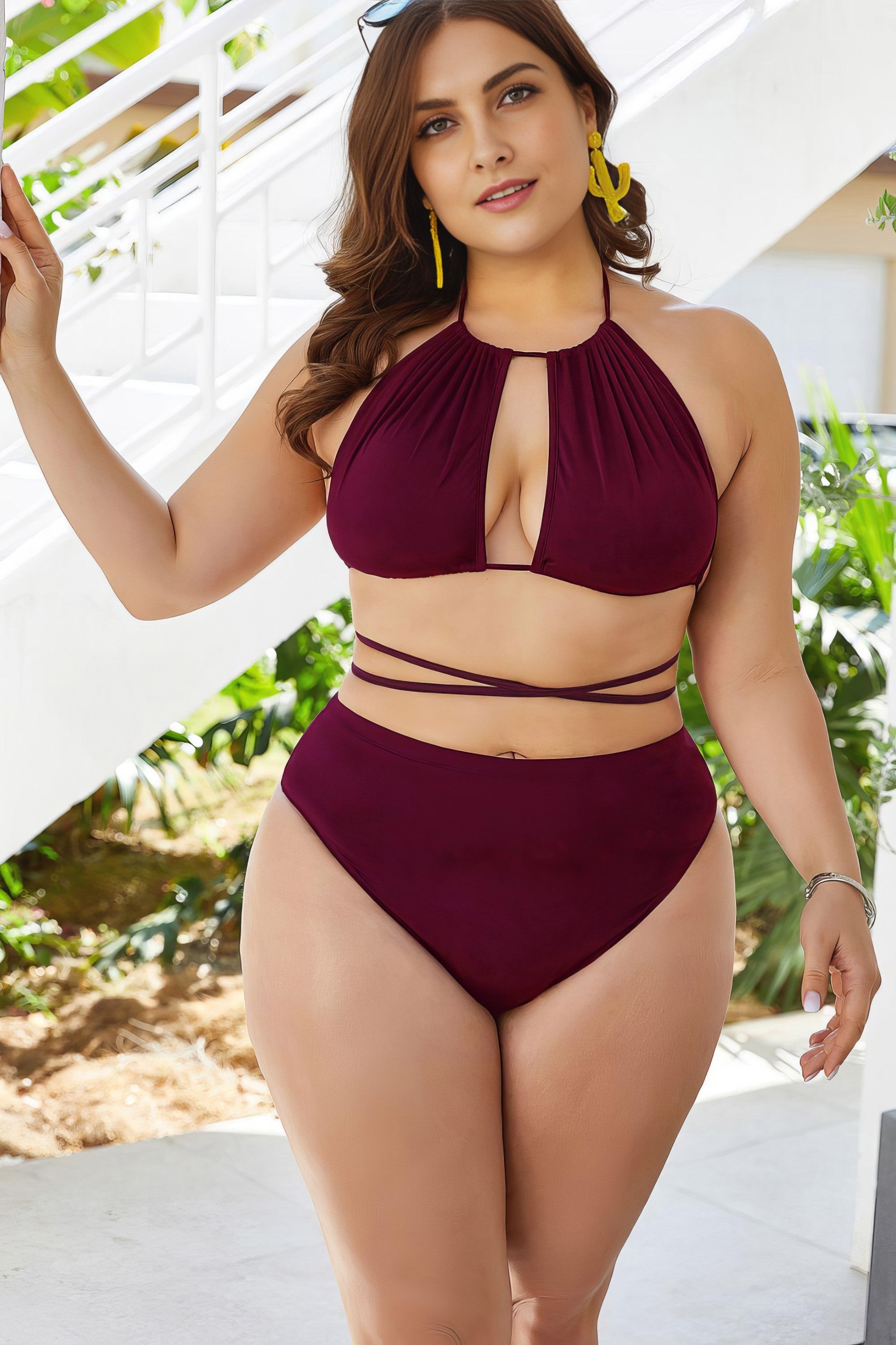 Plus size solid cutout tied backless halter neck bikini set.