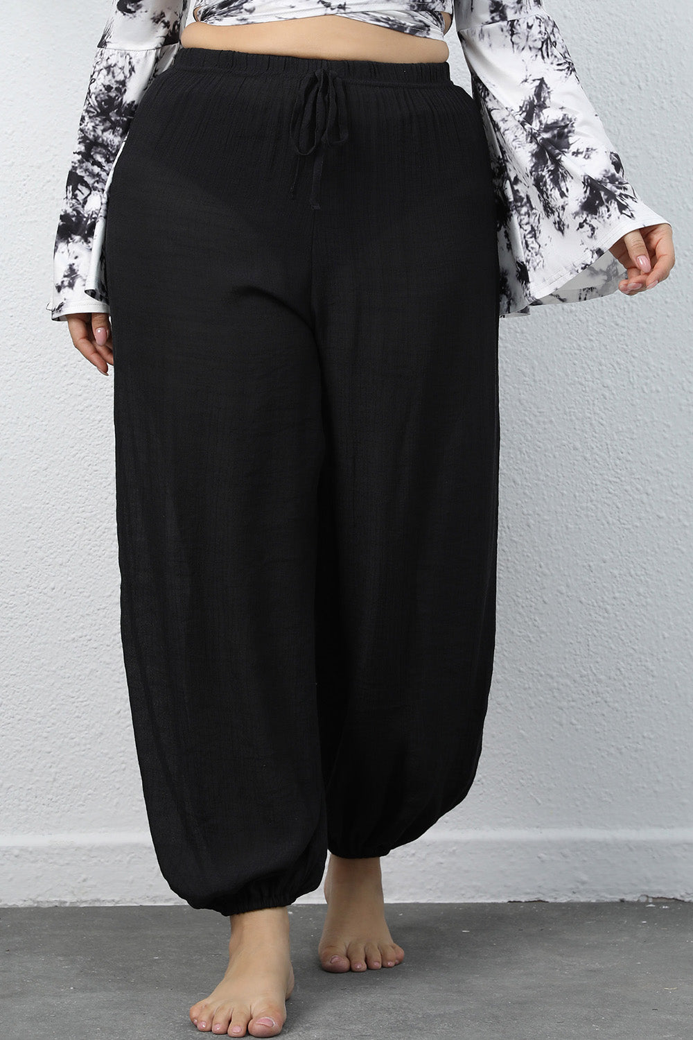 Plus size drawstring jogger pants with tie, opaque.