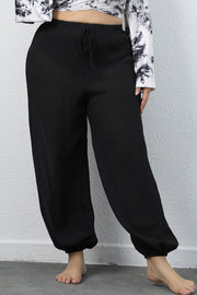 Plus size drawstring jogger pants with tie, opaque.