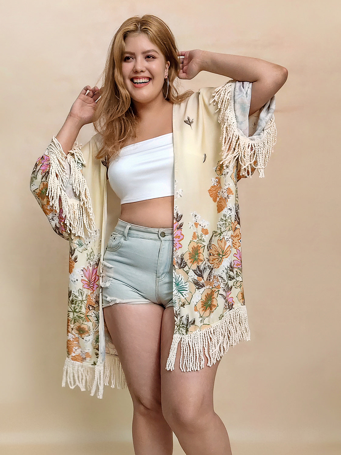 Plus size fringe printed open front cardigan.