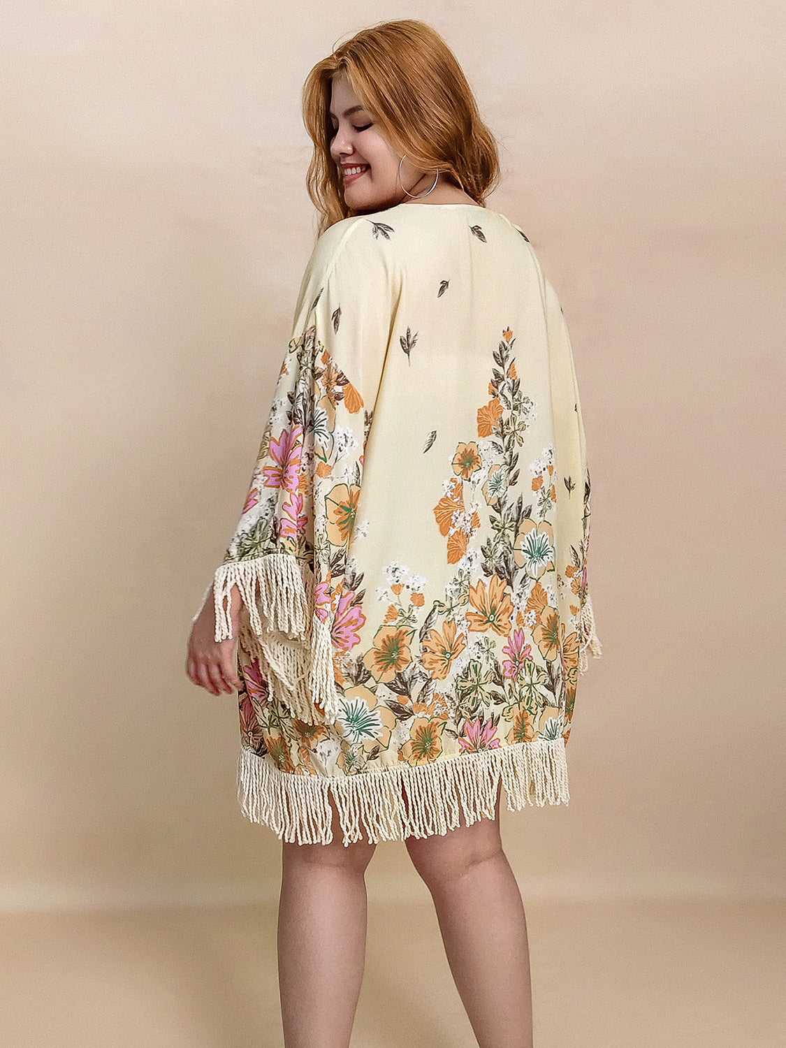 Plus size fringe printed open front cardigan.
