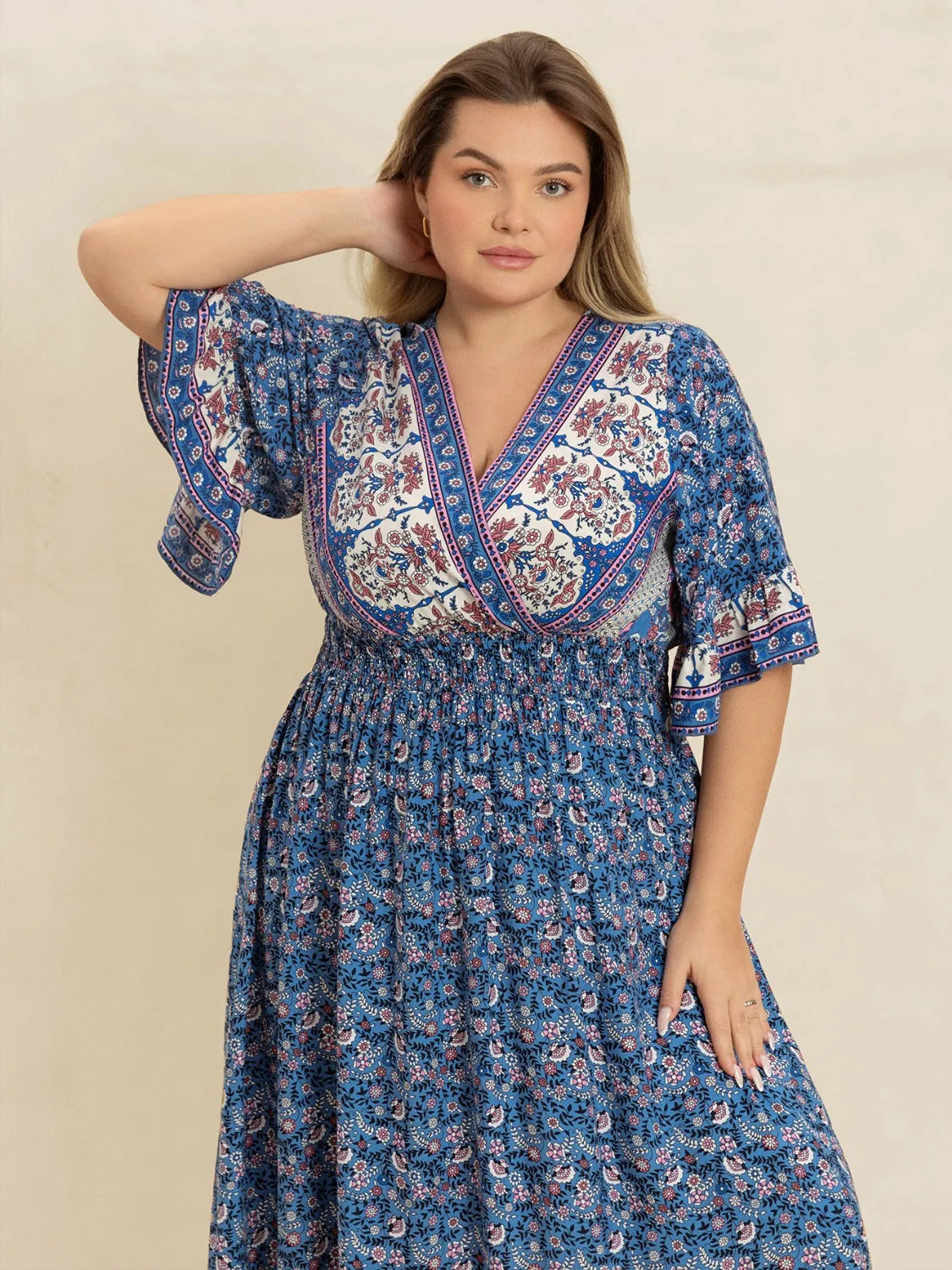 Plus Size Printed Surplice Half Sleeve Dress.