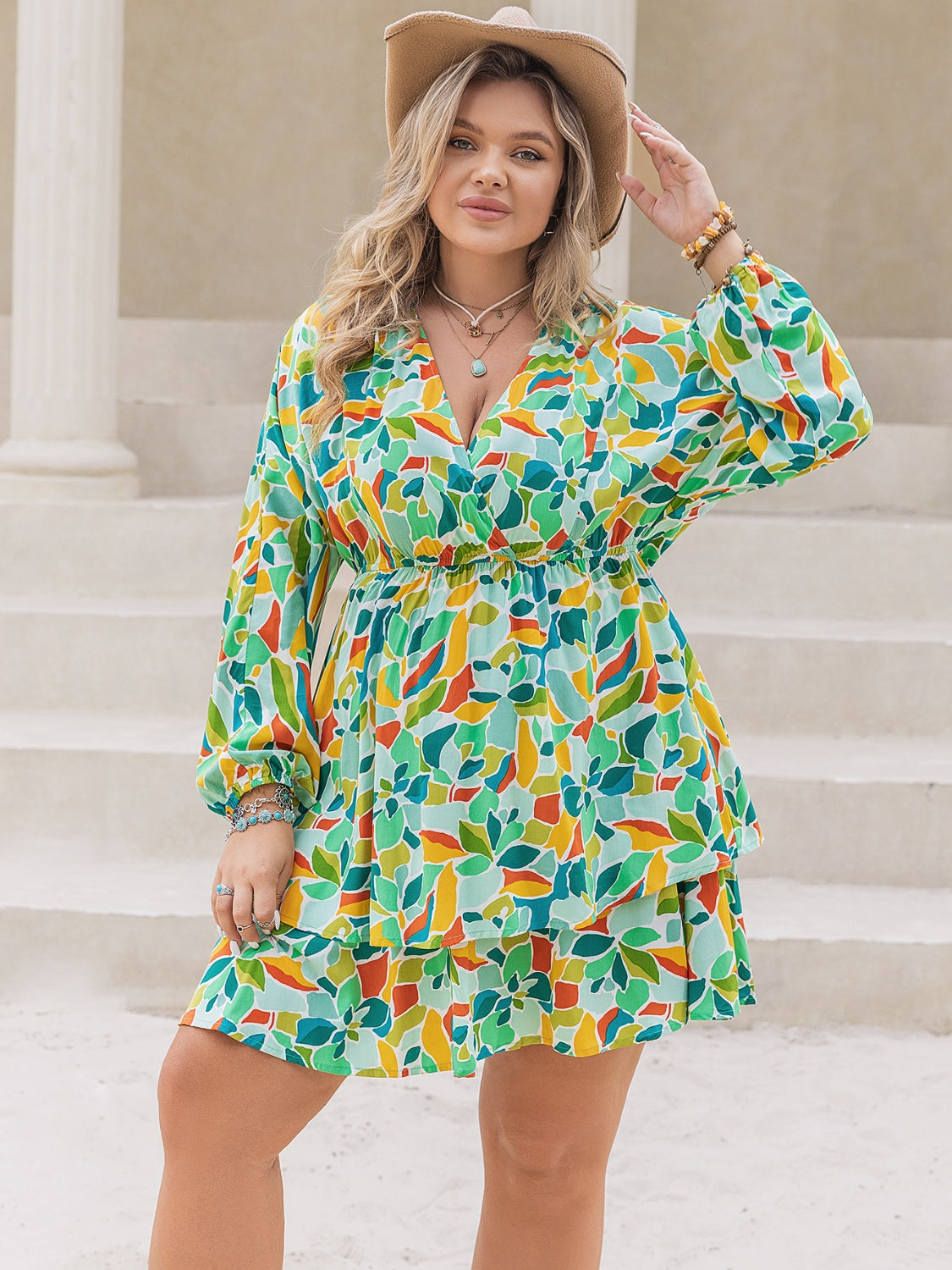 Plus Size Printed Surplice Long Sleeve Mini Dress.