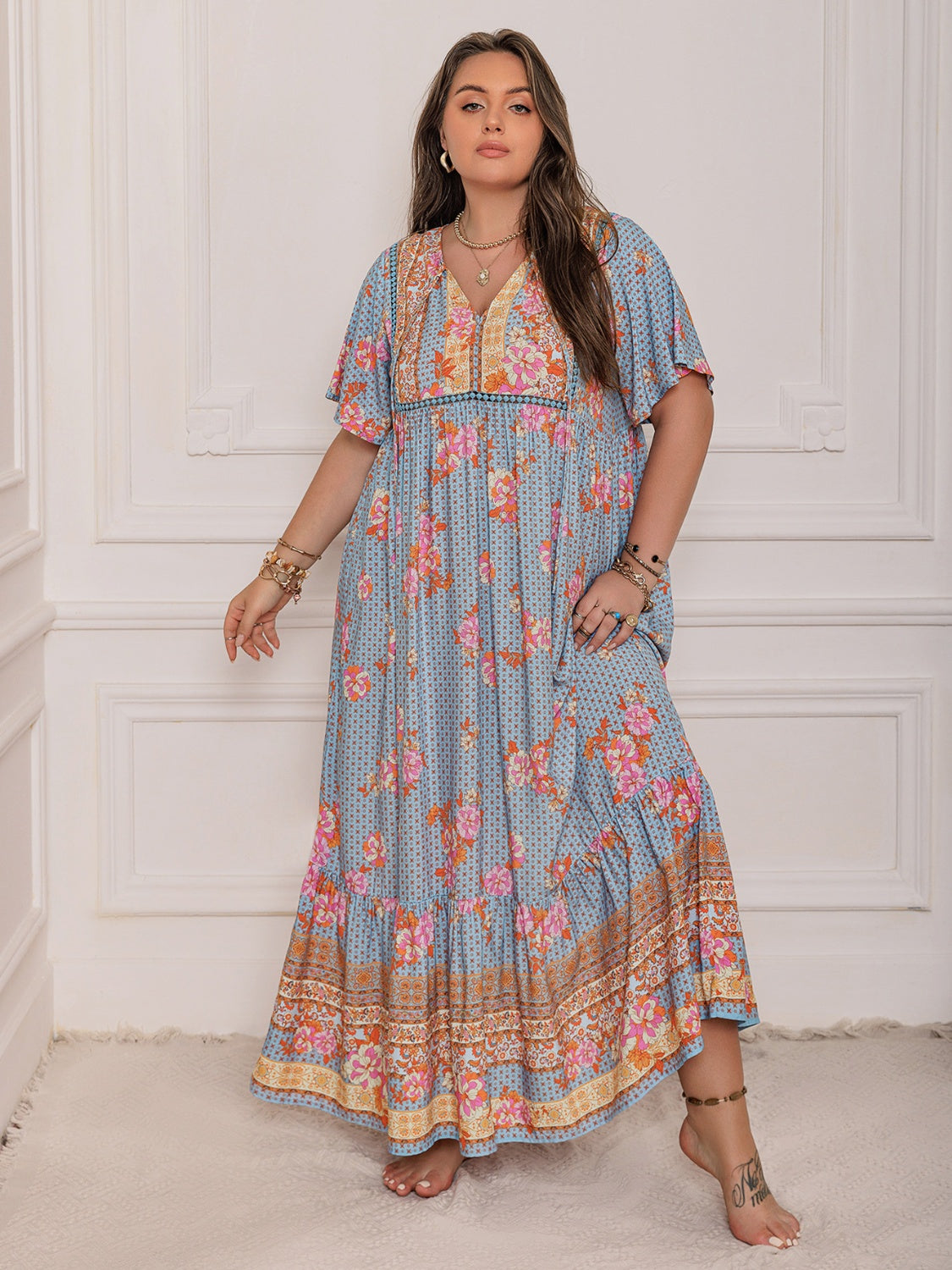 Plus Size Printed Tie Neck Flutter Sleeve Maxi Dress.