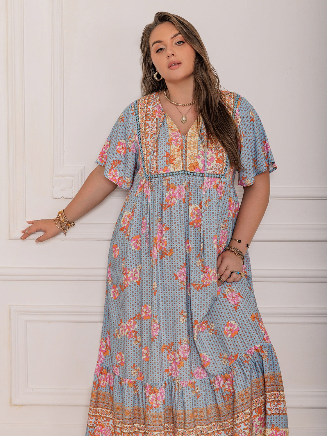 Plus Size Printed Tie Neck Flutter Sleeve Maxi Dress.