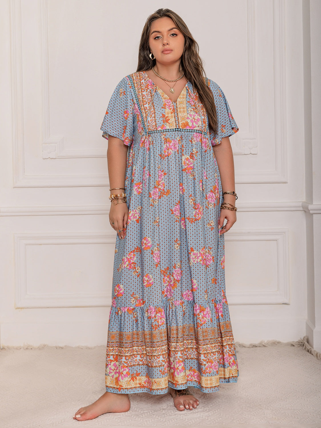 Plus Size Printed Tie Neck Flutter Sleeve Maxi Dress.