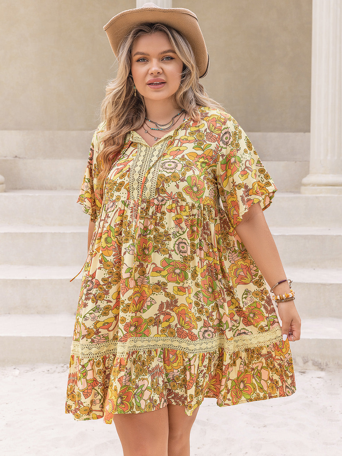 Plus Size Printed Tie Neck Short Sleeve Mini Dress.