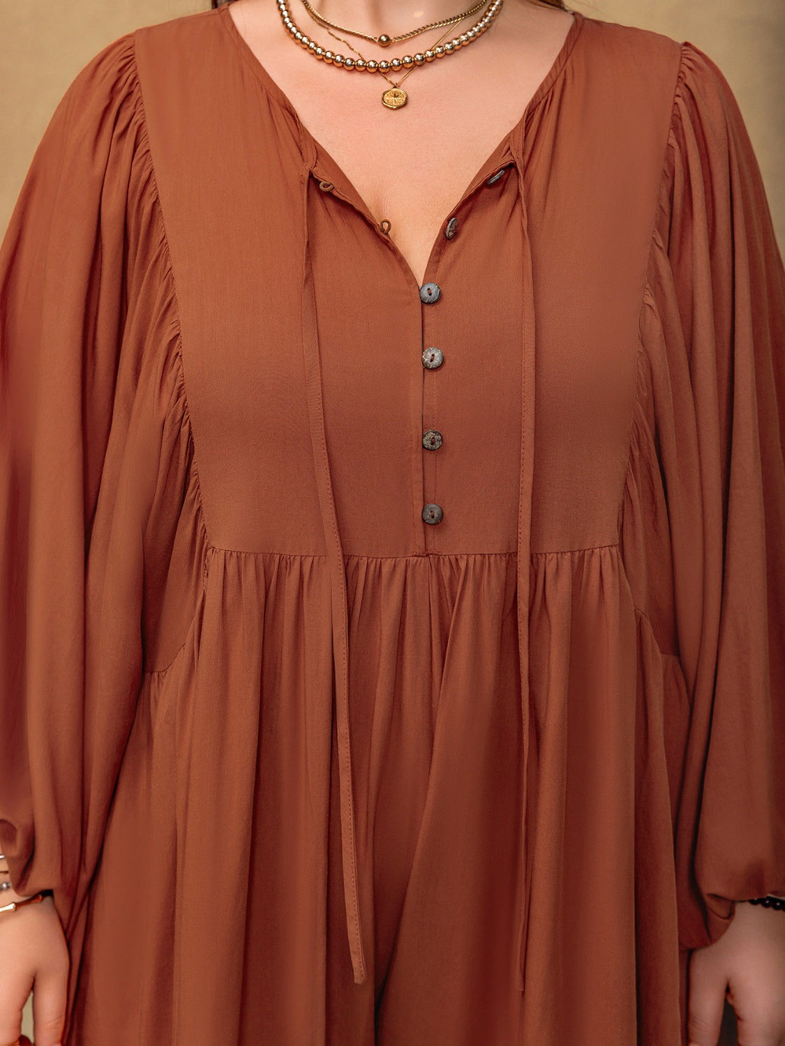 Plus Size Ruched Tie Neck Balloon Sleeve Romper with Buttons.