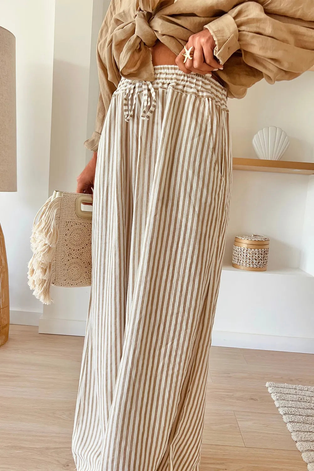 Plus size striped wide leg pants with drawstring, opaque.