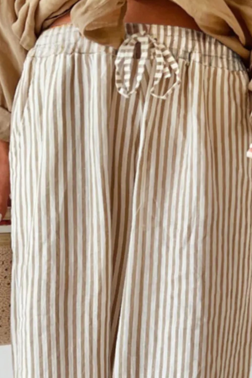 Plus size striped wide leg pants with drawstring, opaque.