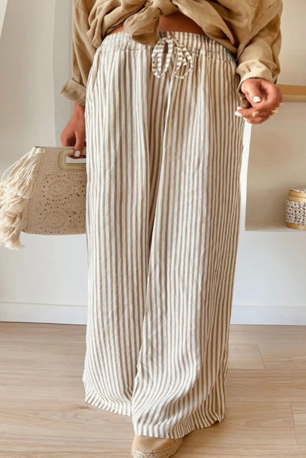 Plus size striped wide leg pants with drawstring, opaque.